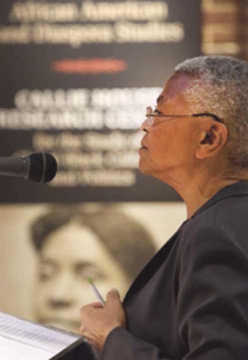 woman standing at microphone