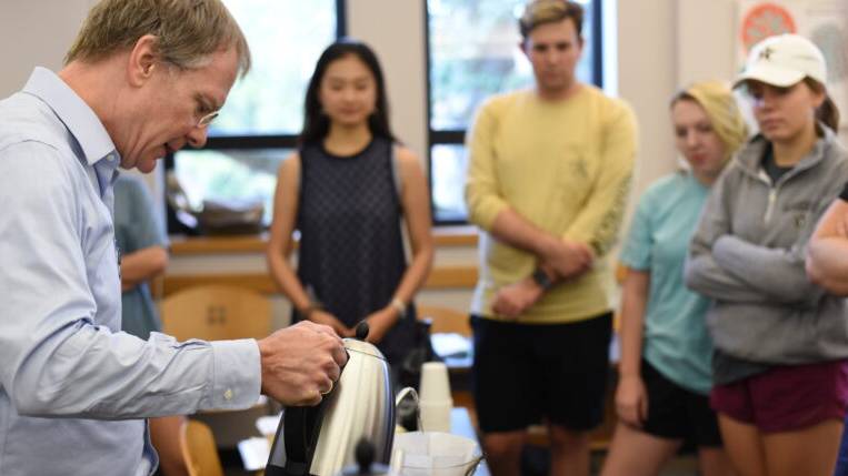 Ted Fischer brewing coffee with students