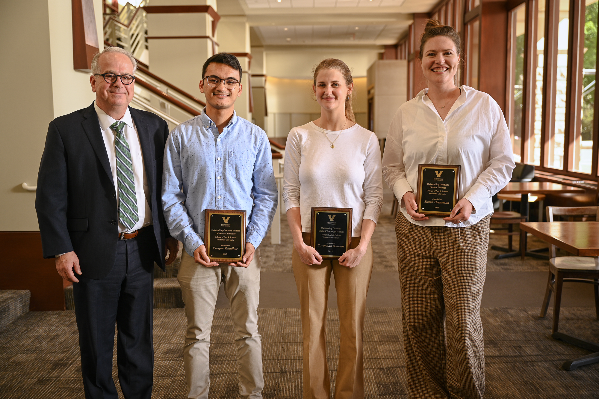 A photo of John McLean and the award winners.