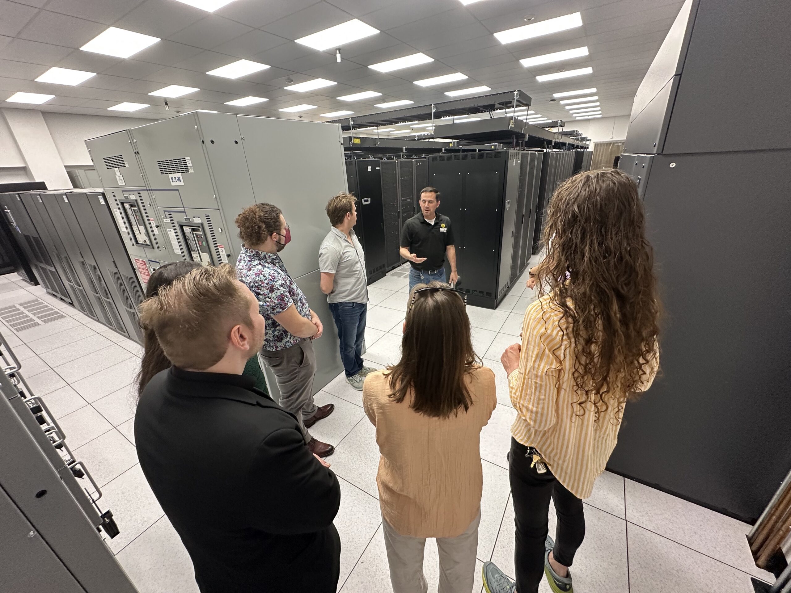 group of people getting tour of a lab